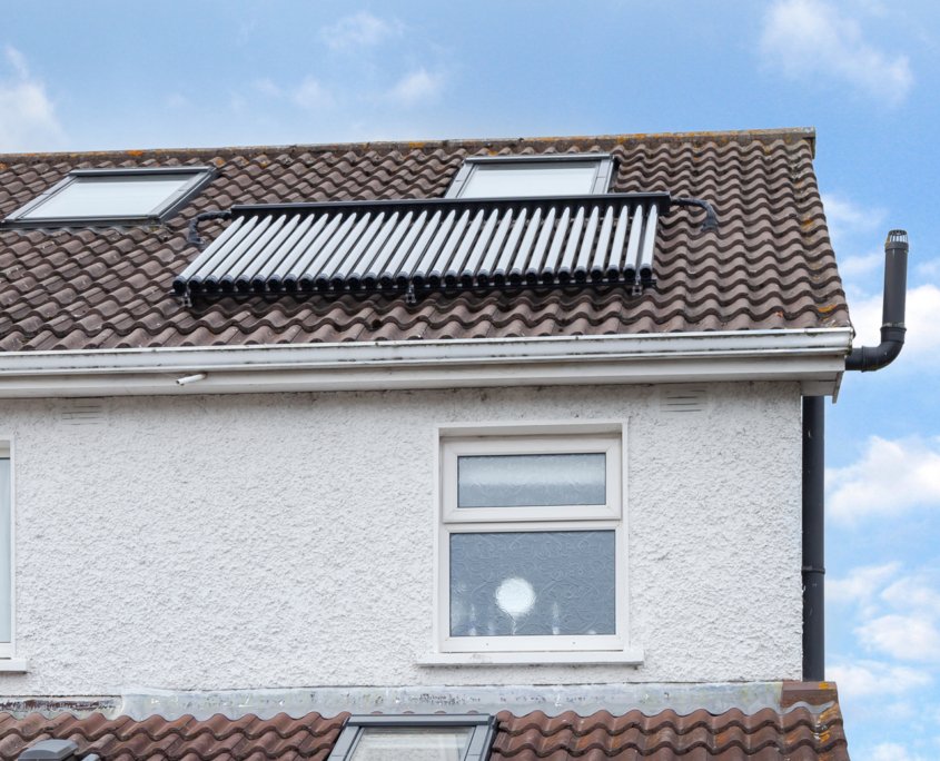 Solar thermal panels on top of a roof in Ireland