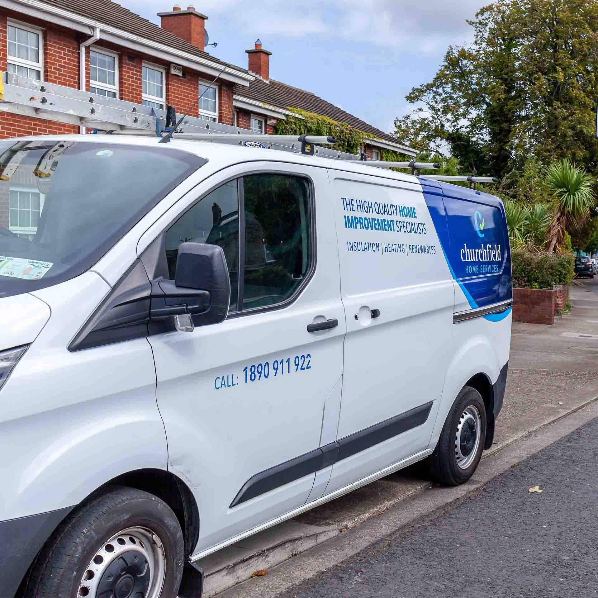 A Churchfield Home Services van parked on a street in Dublin