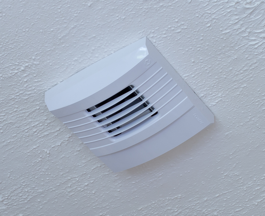 Demand control ventilation unit on a ceiling